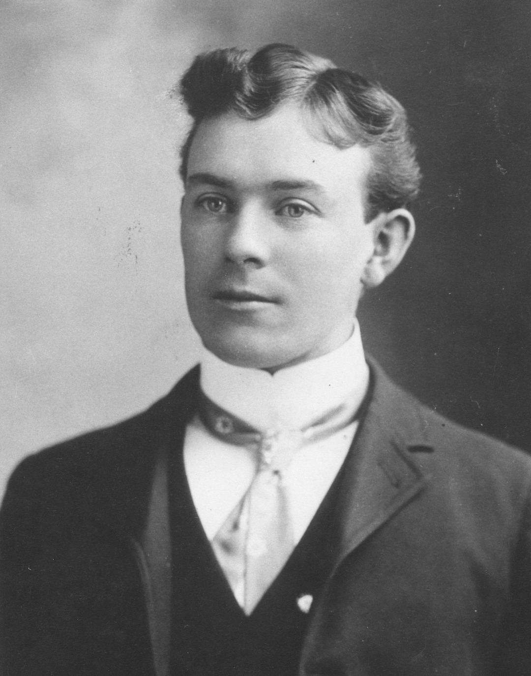 Black and white photographic portrait of John W. Stone as a young man.