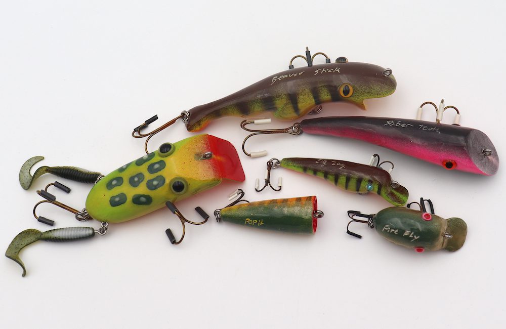 Colourful fishing lures against a white background. Lures are handmade by Pete Horley.