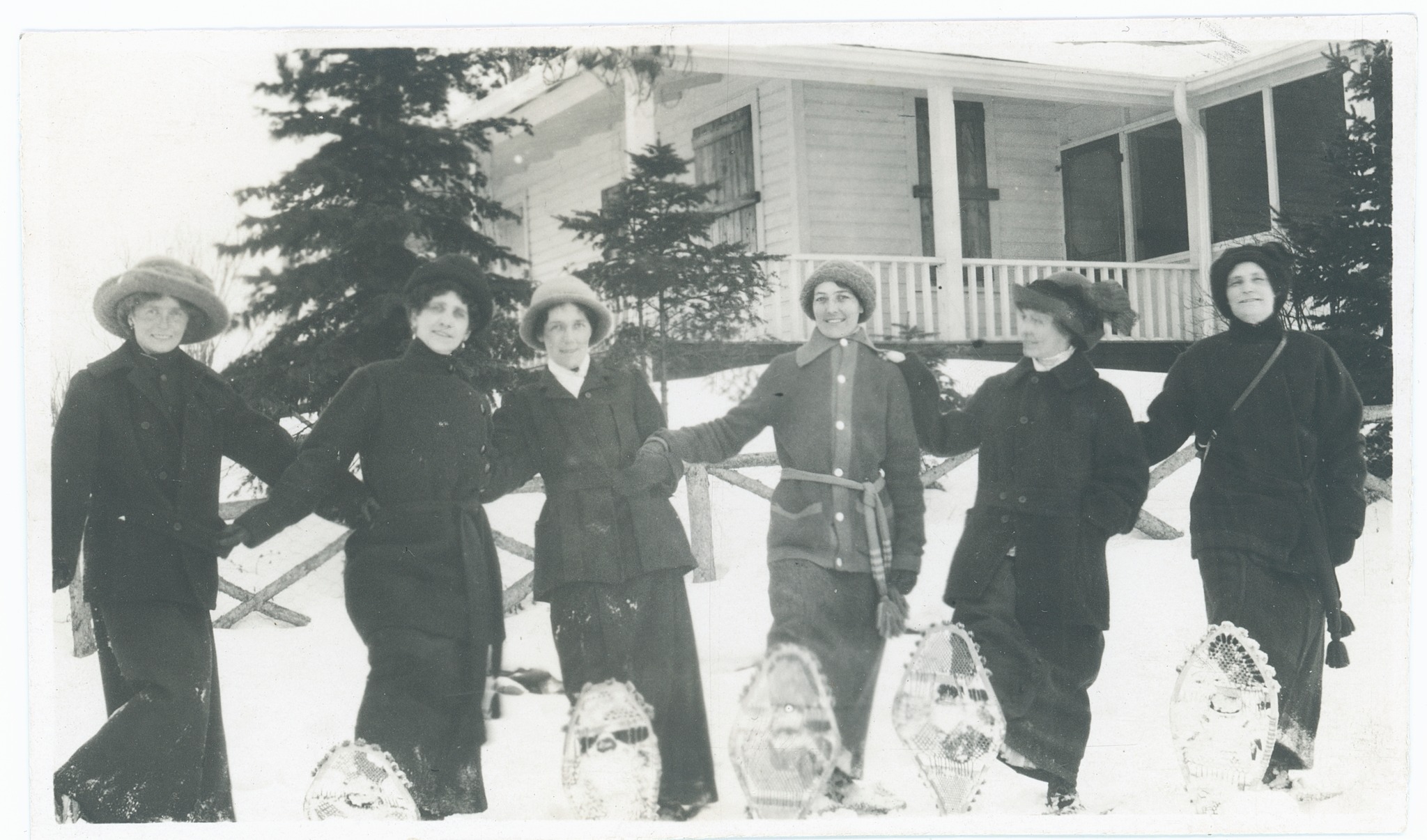 A black and white photograph of six snowshoers in Kenora. C1920s.